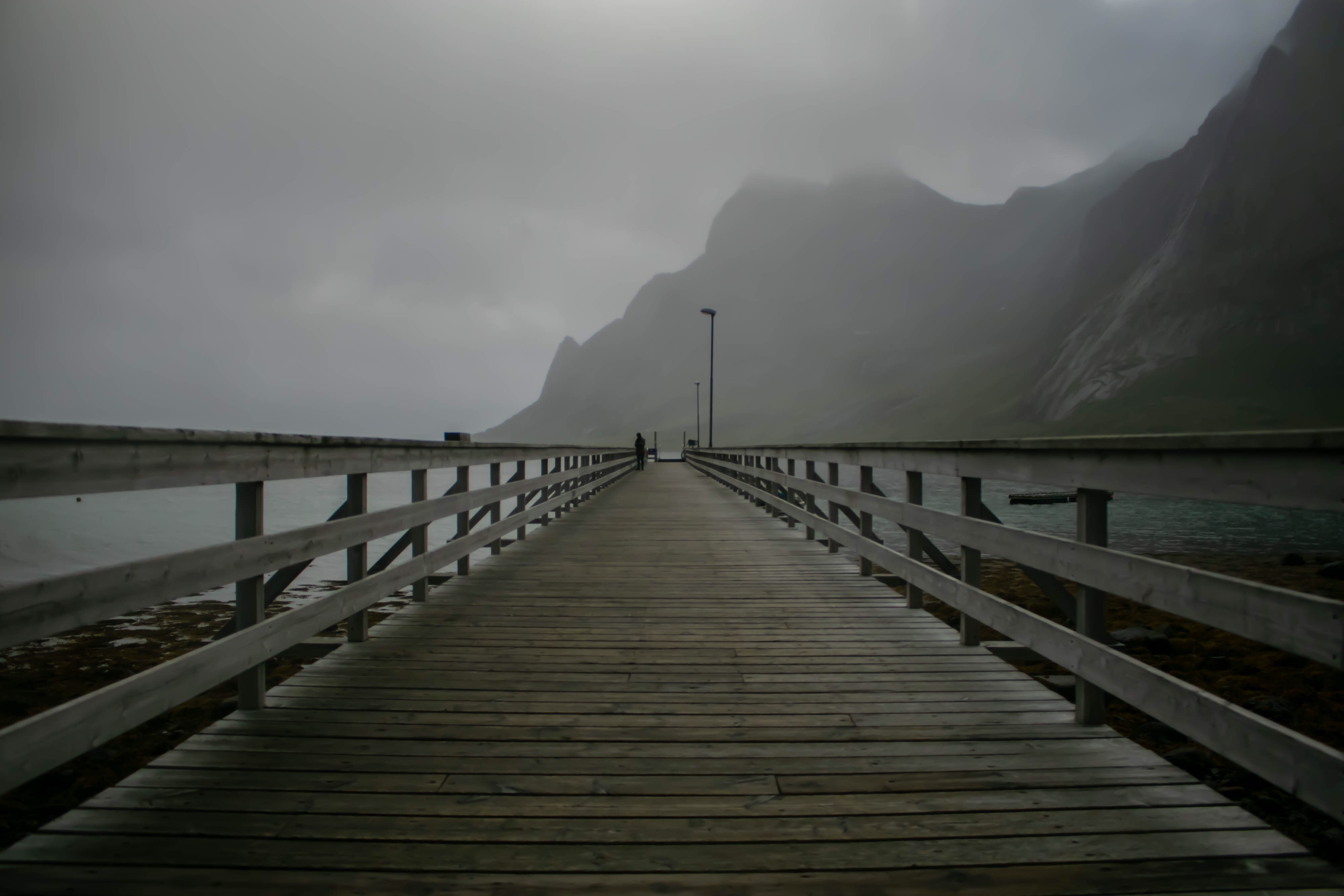 fjord pier, lone figure